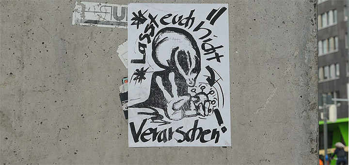 Plakat mit einem "Kleinen Grauen"